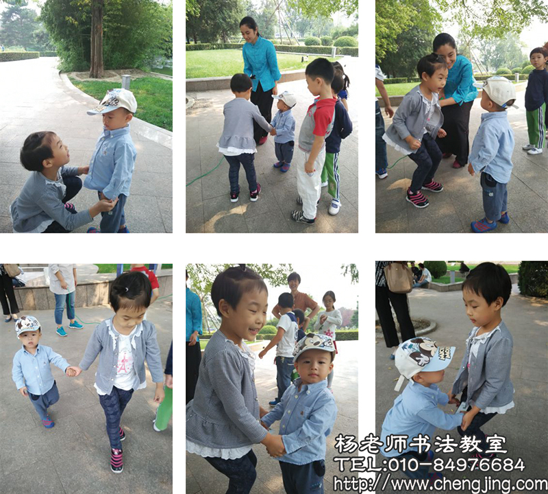  一旁路過的小弟弟，被我們的游戲活動吸引過來，熱心的同學趕緊伸出手說“來姐姐教你，拉著姐姐手，身體往上蹦”小同學熱情、認真地當起了小老師。